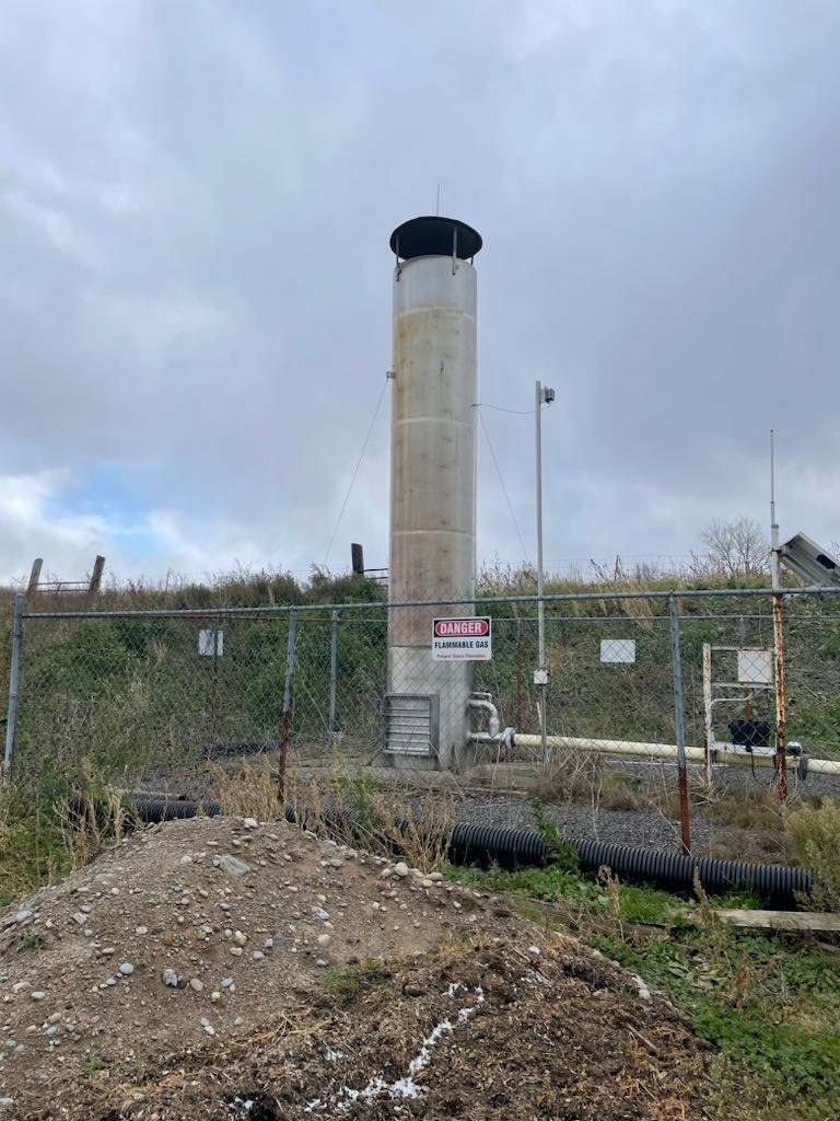 The flare stack of a broken anaerobic digester on a dairy farm, which is currently venting methane to the atmosphere.